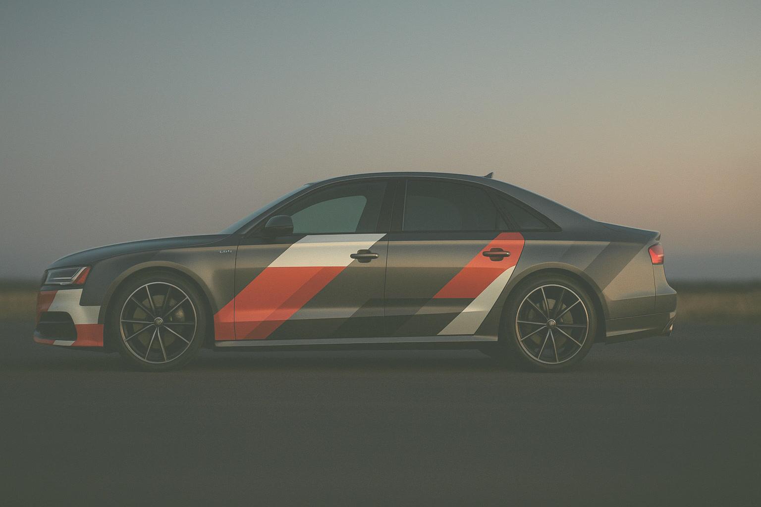 The 2017 Audi S8 in heritage racing livery, rendered street-side